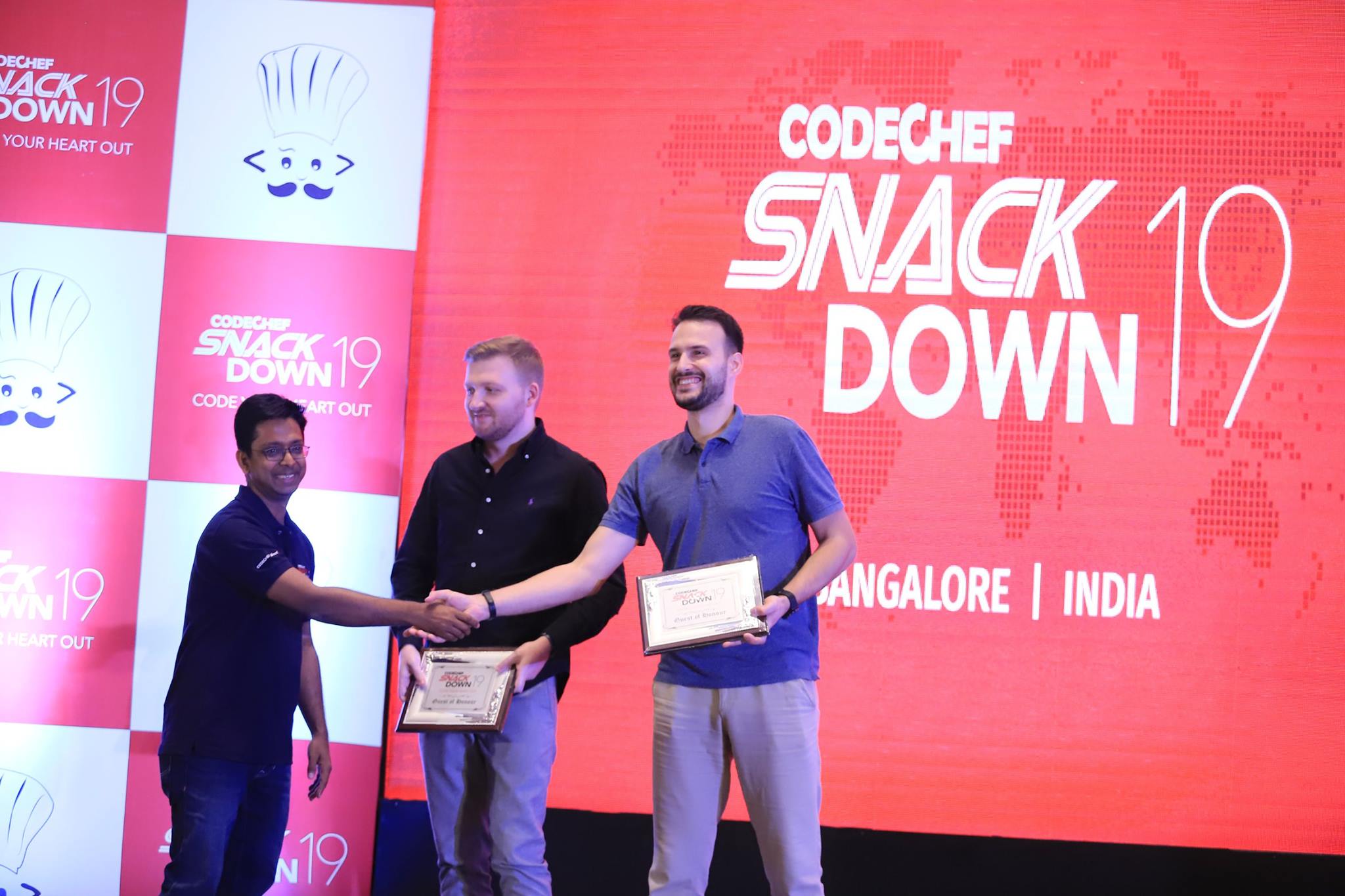 A picture of Sphere Engine staff members giving awards during a code challenge held in Bangalore, India